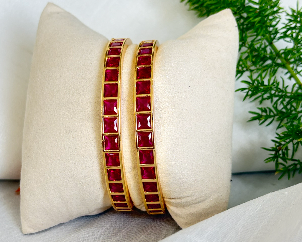 Pinkish Red Stoned Gold-Rimmed Bangles