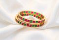 Red and Green Stoned Gold-Rimmed Bangles