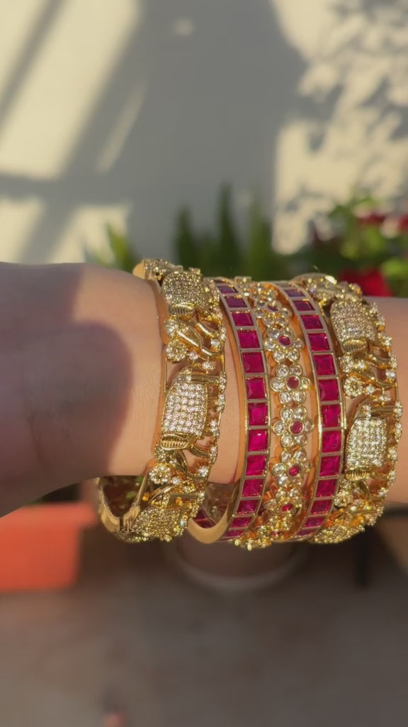 Pinkish Red Stoned Gold-Rimmed Bangles